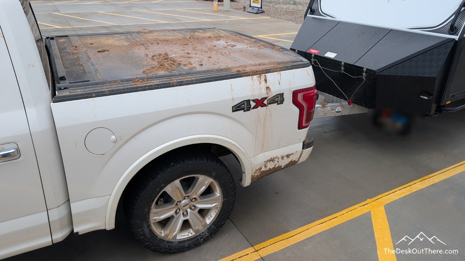 Mud splashed across the pickup and camper after reaching paved ground.