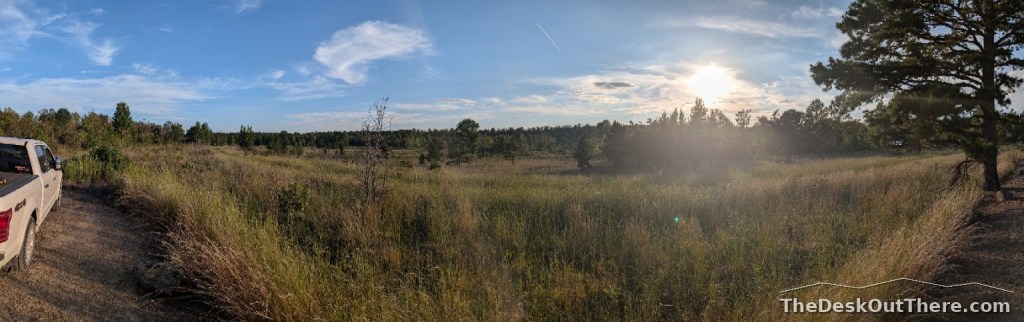 Wide view of the rural Arkansas landscape near the camping area at sunset.