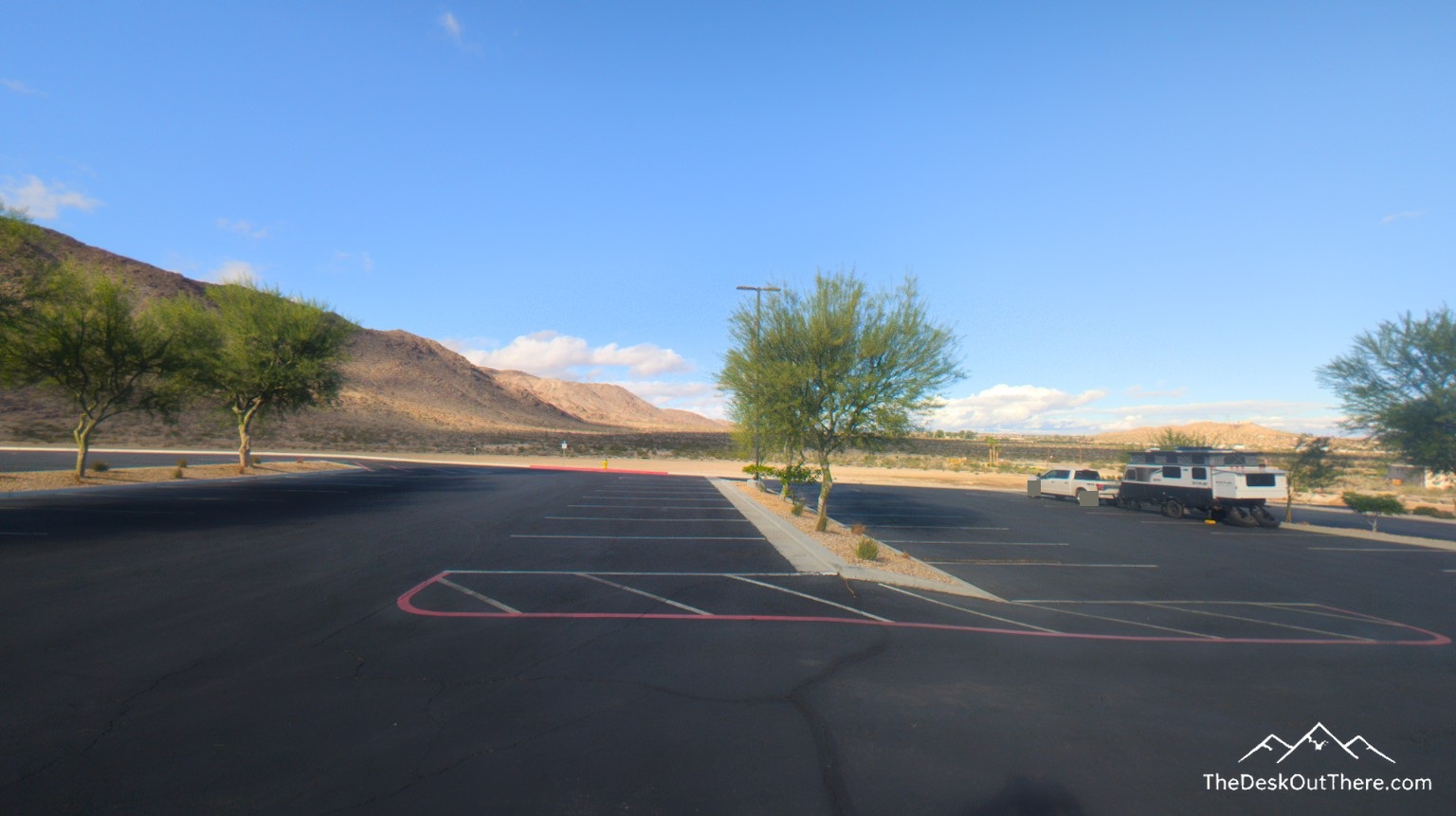 Truck and camper on pavement at Tortoise Rock Casino